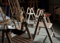 Chaise pliante design Ika avec sangle en cuir