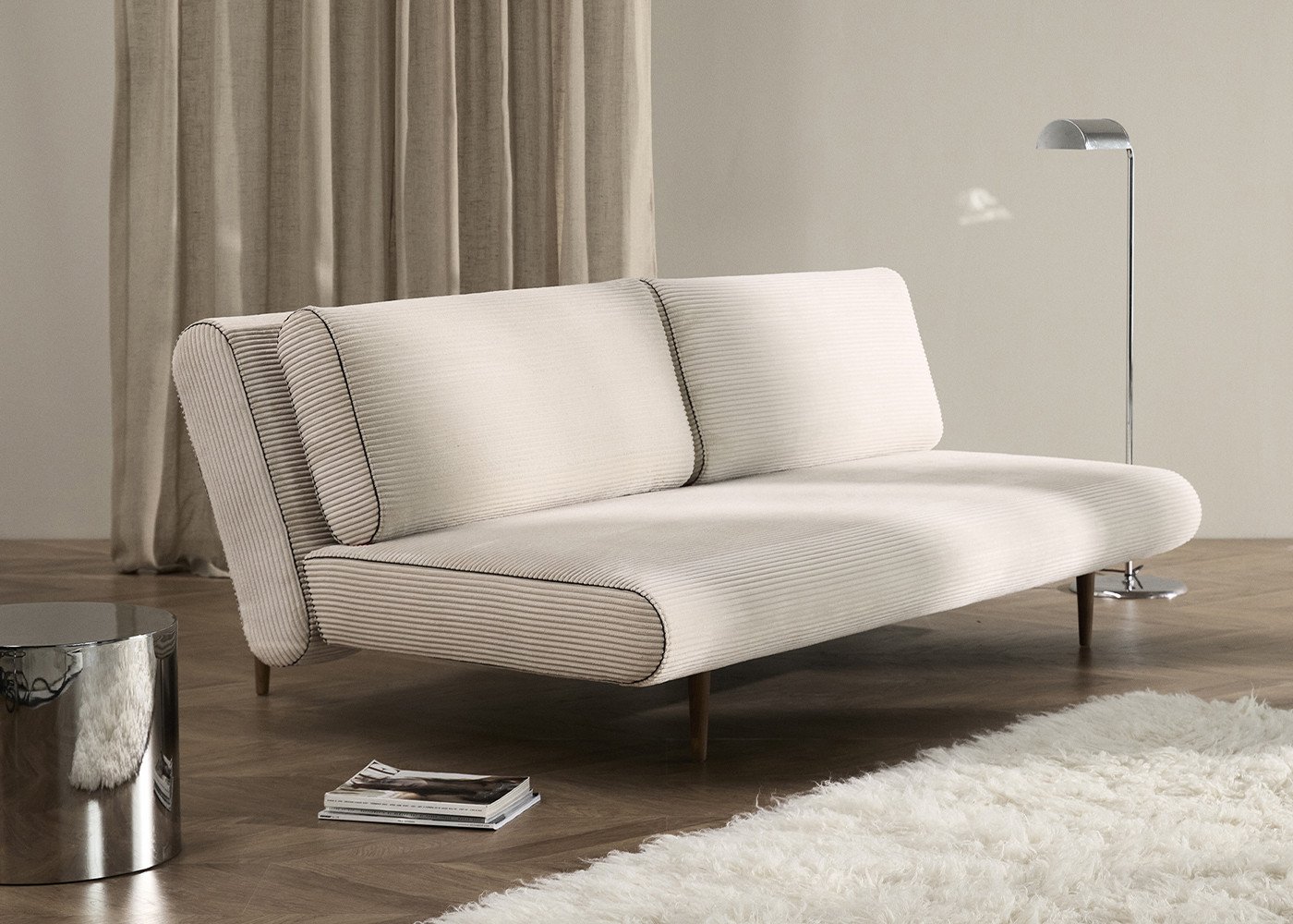 Mesure de la profondeur d’un canapé convertible dans un salon