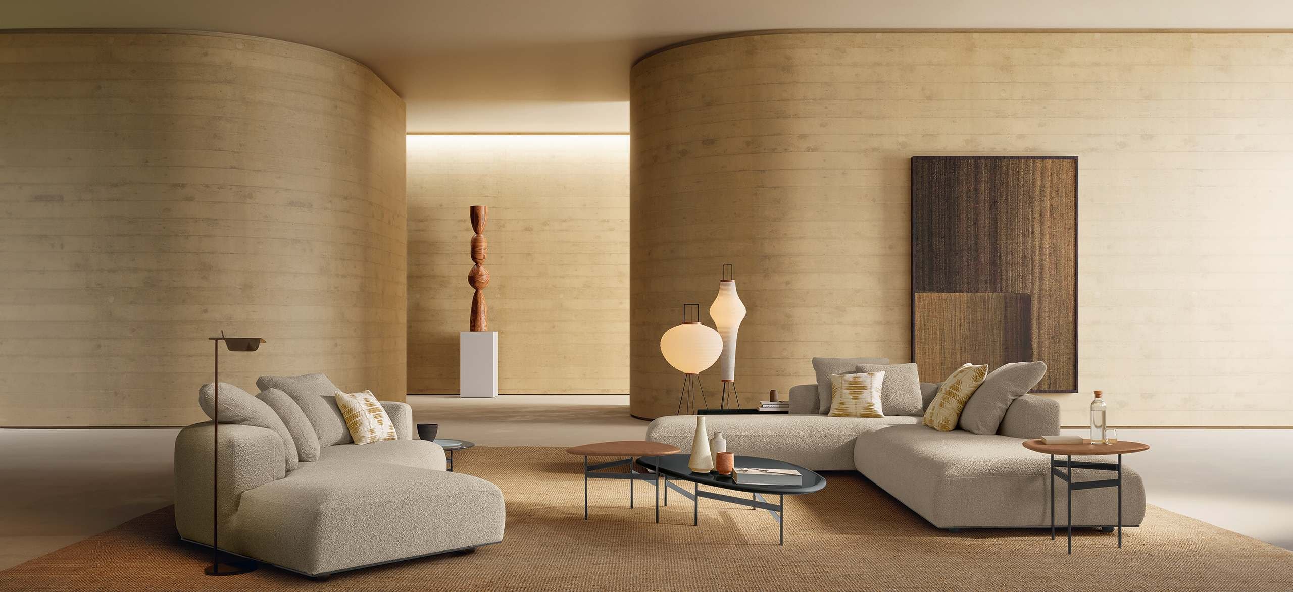 Salon contemporain avec mobilier aux formes organiques, matières texturées et éclairage chaleureux